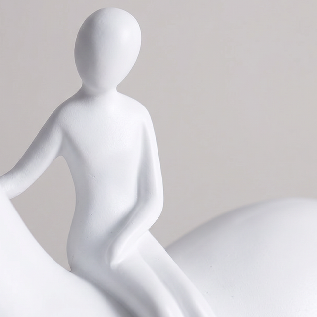 close up of white rider figurine on horse