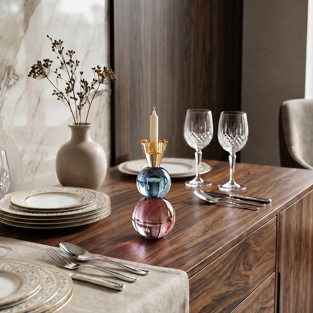 colorful crystal candle holder on wooden sideboard