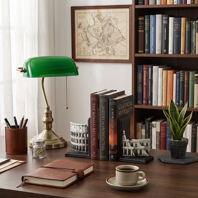 colosseum bookends on study desk with green lamp