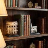colosseum bookends on wooden shelf with classic books