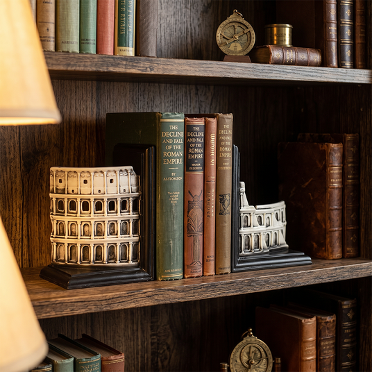 colosseum bookends on wooden shelf with classic books