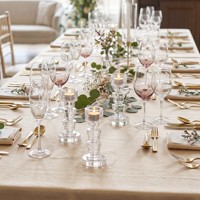 crystal candle holders on long gold dining table