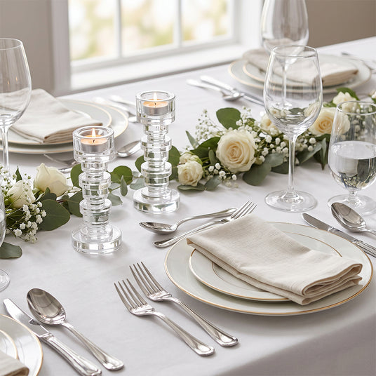 crystal candle holders on white dining table setting