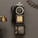 distressed resin decorative desk phone hanging on the wall