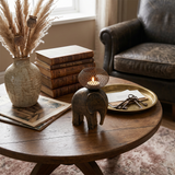 elephant candle holder on coffee table with books