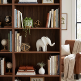 elephant sculpture on bookshelf