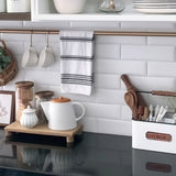 embossed ceramic teapot with bamboo wood lid in the kitchen