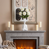 figure vase with flowers on marble fireplace