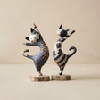 figurines two blue standing cats white background