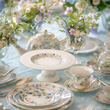 floral vine embossed ceramic serving cake stand on the dining table