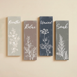 four vertical wooden botanical line art wall signs