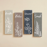 four vertical wooden botanical line art wall signs