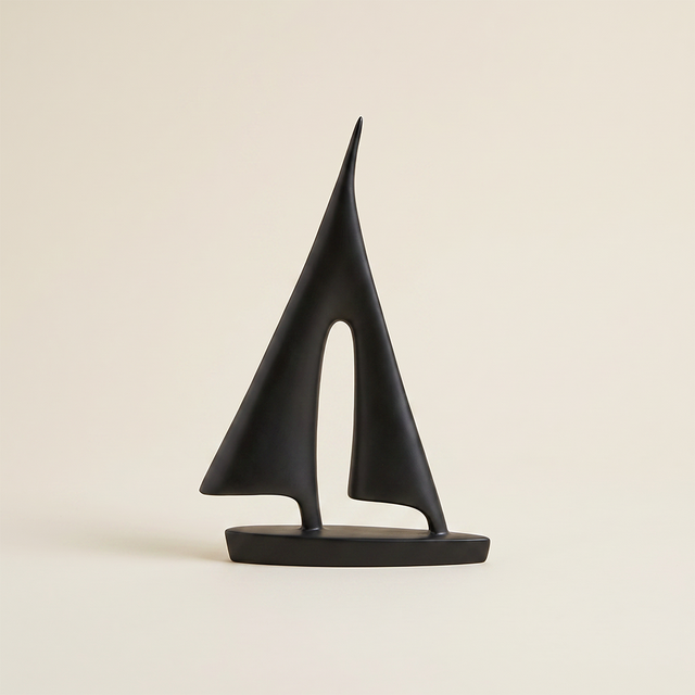 geometric sailboat sculpture on beige background