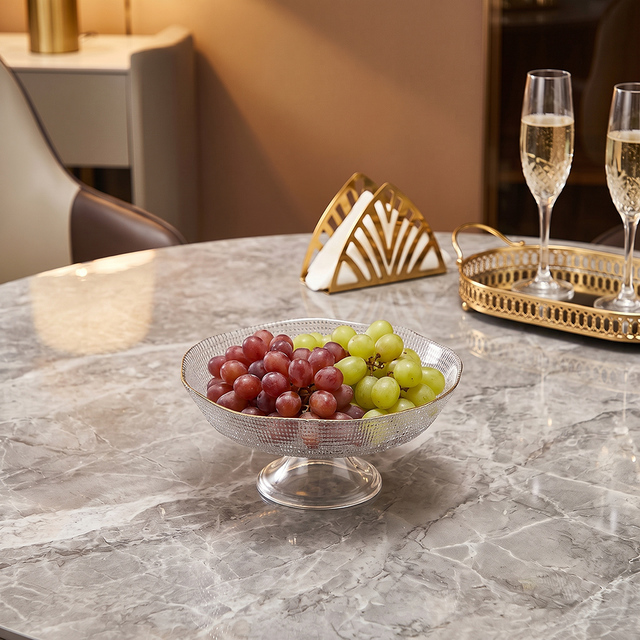 glass bowl with grapes on marble table