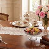 glass bowl with macarons on wooden table