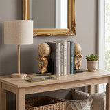 gold bookends on wooden stand