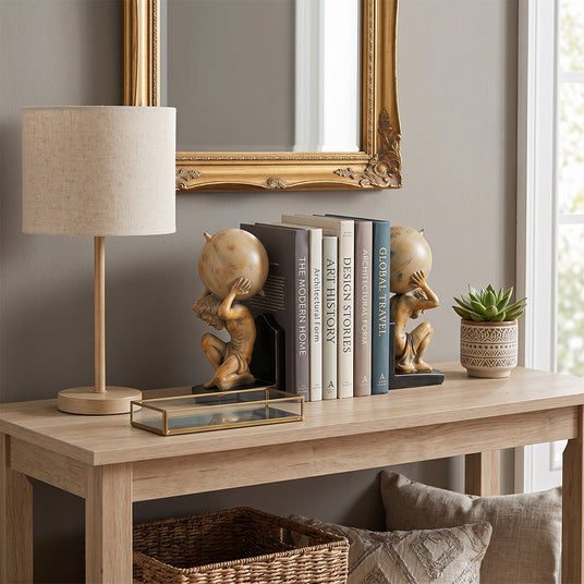 gold bookends on wooden stand