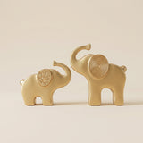 gold elephant sculptures front view