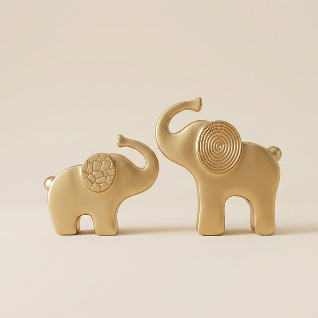 gold elephant sculptures front view