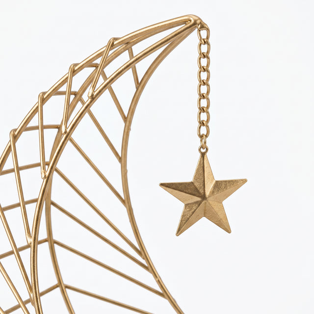 gold moon star candlestick closeup
