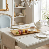gold tray with cups on desk