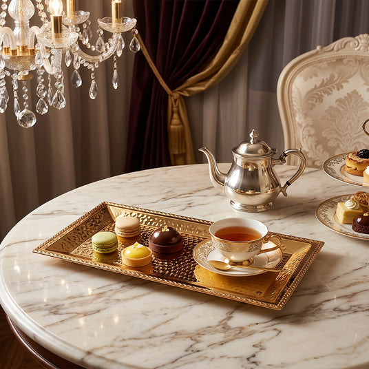 gold tray with treats on round table