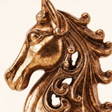 golden horse head sculpture detail close up
