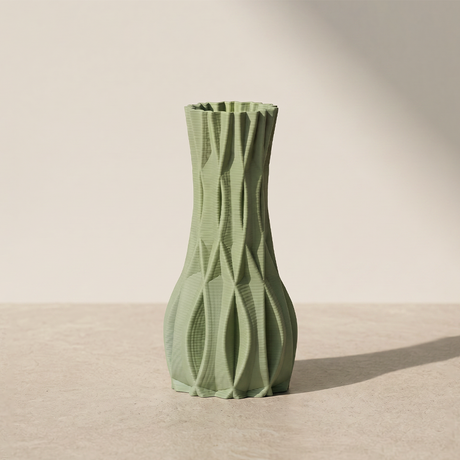 green faceted vase on neutral background