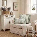green ruffle pillows on white cottage sofa
