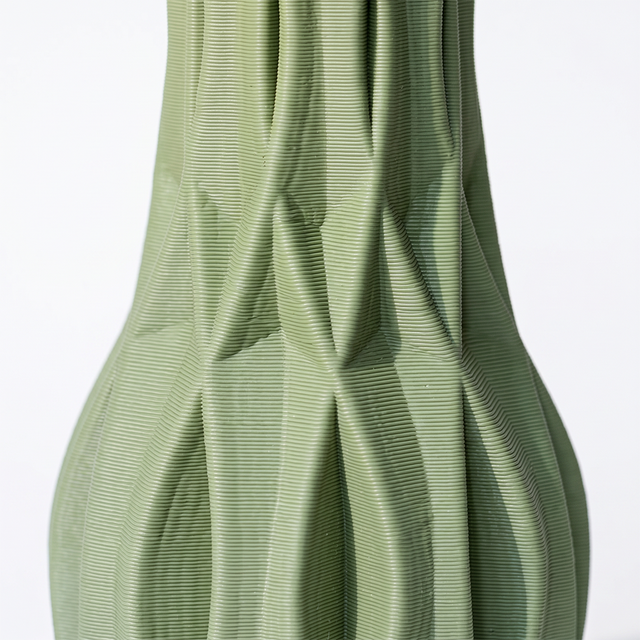 green vase ribbed texture detail