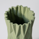green vase top opening close up