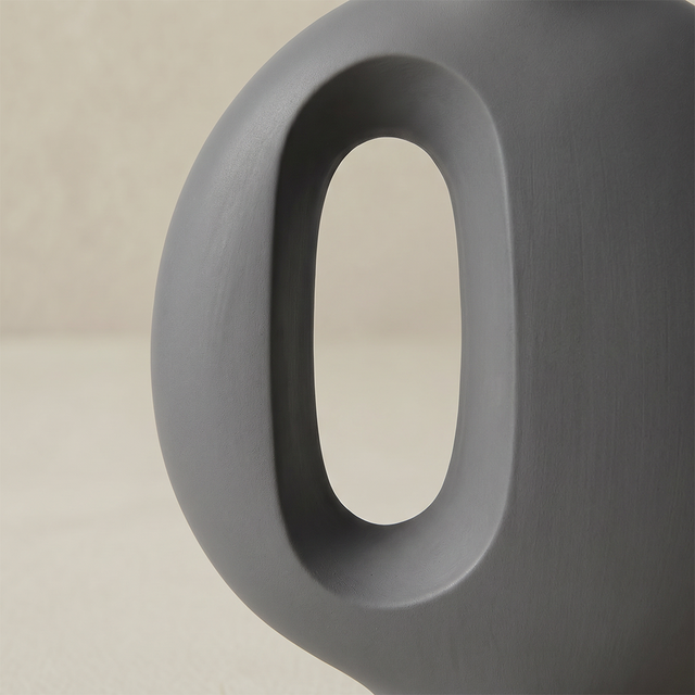 grey vase oval hole side detail shot