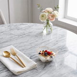 heart shaped glass bowl with yogurt on marble table