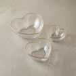 heart shaped glass bowls on beige background