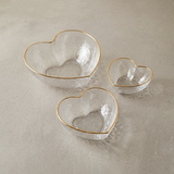 heart shaped glass bowls on beige background