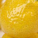 lemon candle holder textured surface macro