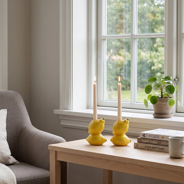 lemon candle holders near bright window