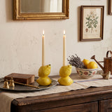 lemon candle holders on rustic wooden dresser