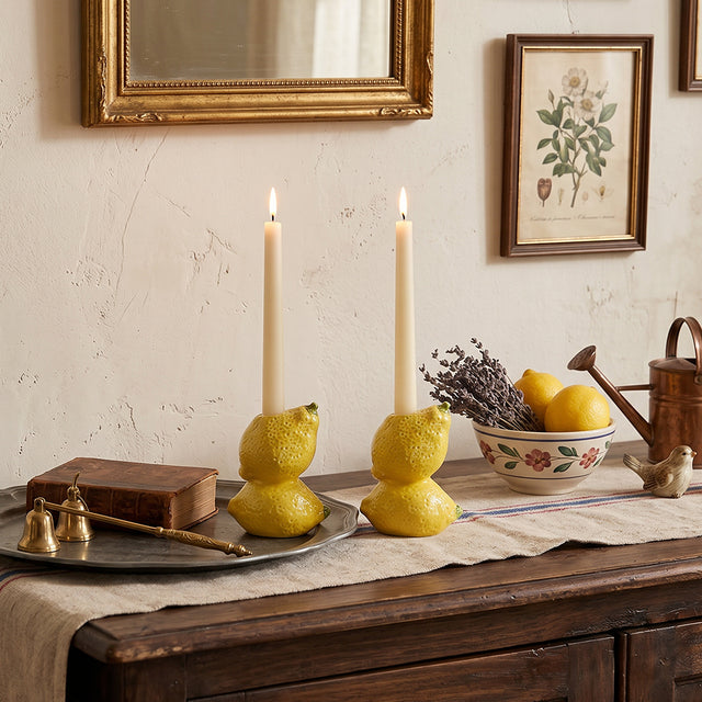 lemon candle holders on rustic wooden dresser