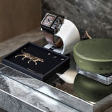 leopard print leather tray with other small items