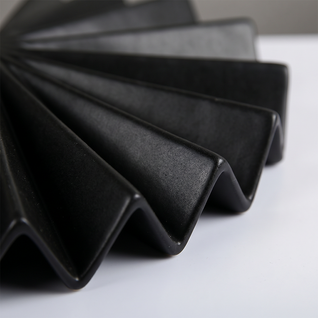macro shot of black pleated vase folded edge