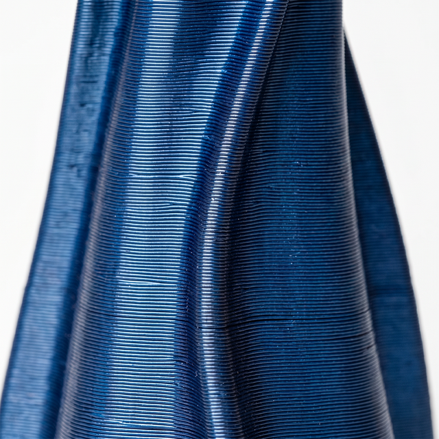 macro shot of blue spiral vase ribbed texture