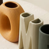 macro shot of ceramic letter vases openings and texture
