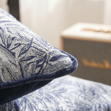 macro shot of jacquard pillow corner and piping
