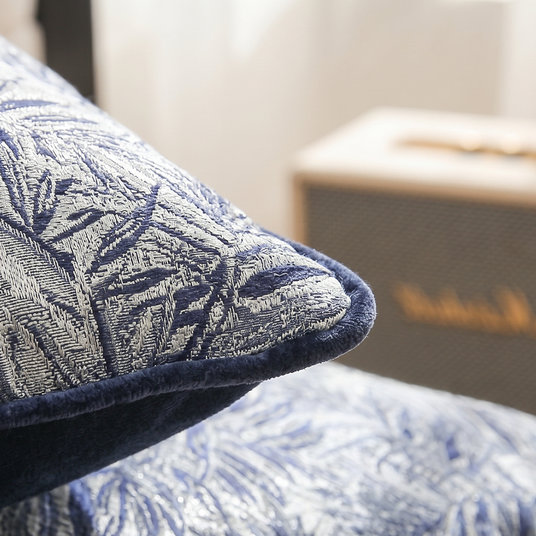 macro shot of jacquard pillow corner and piping