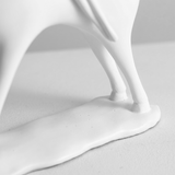 macro shot of white sculpture base and legs