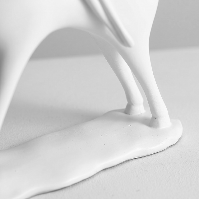 macro shot of white sculpture base and legs