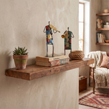 metal musician figurines on wooden shelf books