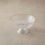 middle glass bowl on beige surface