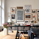 minimalist wooden rectangular digital wall clock beside the hanging painting
